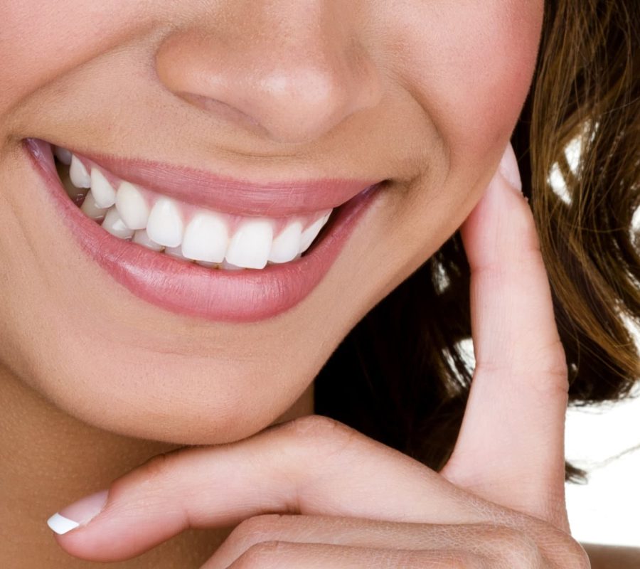 Closeup of a woman with perfect teeth smiling